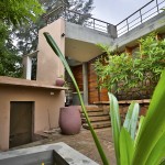 entrance of villa aaranyak - farmhouse design india