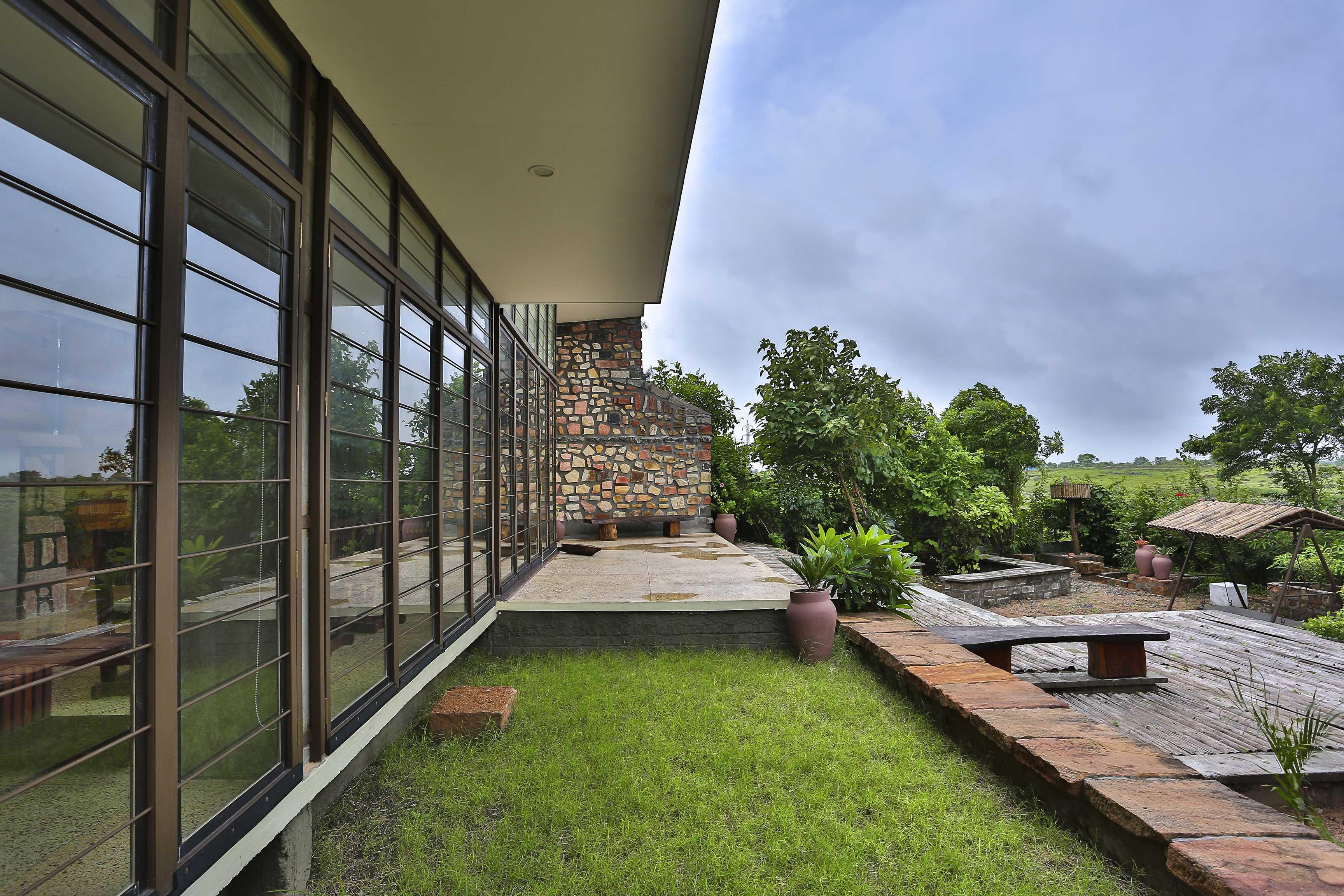 modern landscape design of villa aaranyak - weekend home concept india