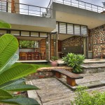 stone wall in farmhouse design - villa aaranyak