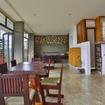 terrazzo flooring and teak wood furniture - farmhouse design